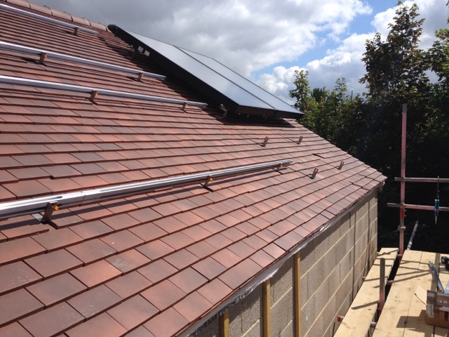 In-roof solar panels on a clay tiled roof